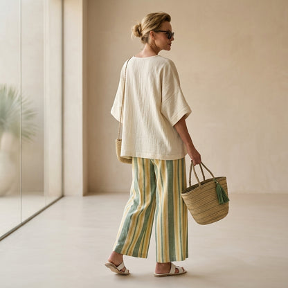 Caterina – an elegant top and striped linen trousers for a chic and sophisticated look