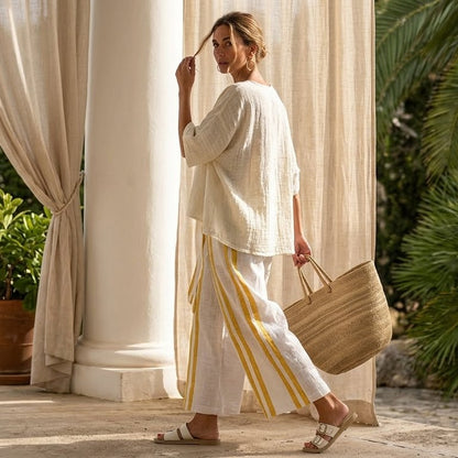 Arianna – Elegant linen set: yellow striped top and wide-leg pants